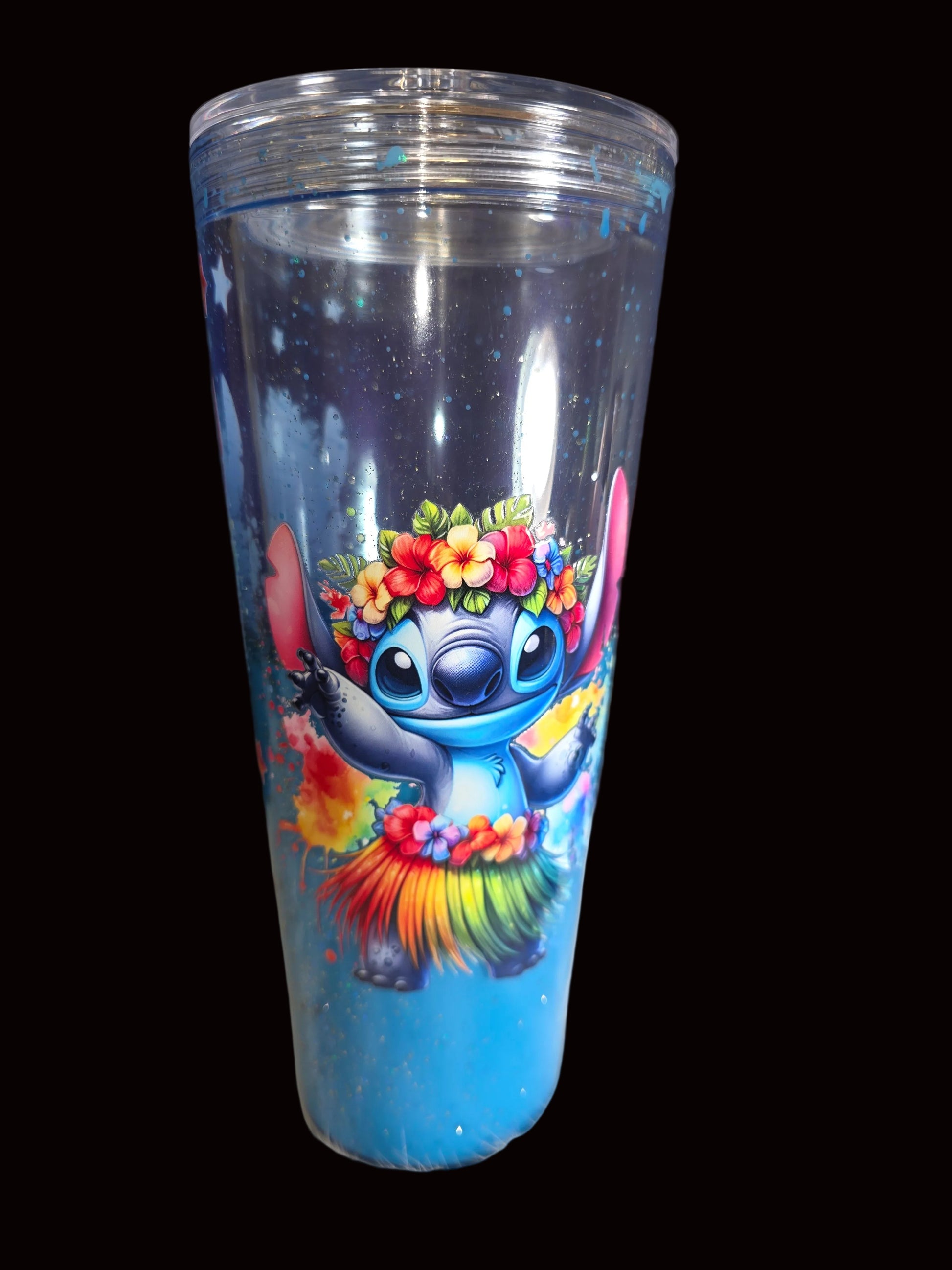 Tumbler with colorful character design on a dark background